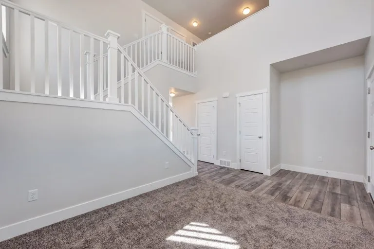 Gathering area and stairs in a new home from McArthur Homes.