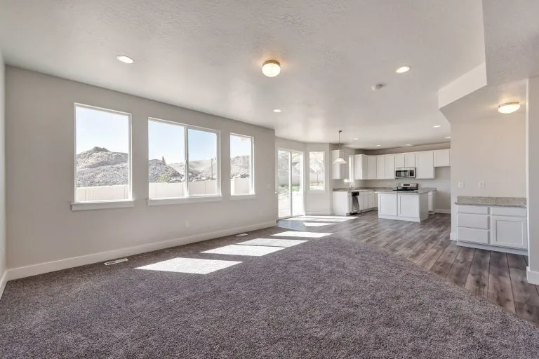 Open kitchen area and gathering area in a new home from McArthur Homes..