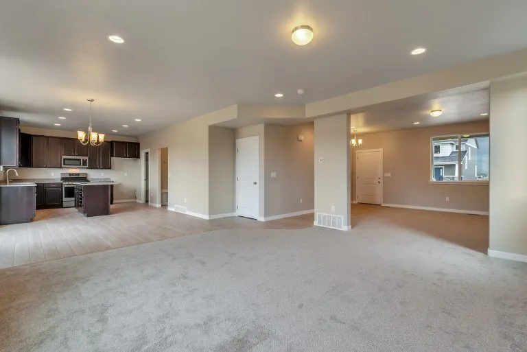 Kitchen and gathering room in a new home from McArthur Homes.