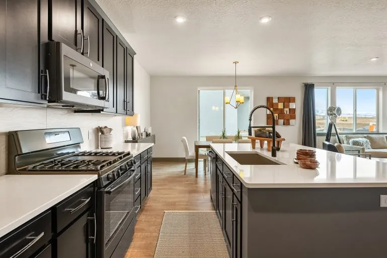 Kitchen With An Island Inside a New Home From McArthur Homes