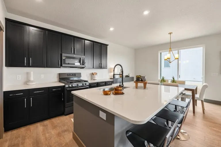 Kitchen With An Island Inside a New Home From McArthur Homes