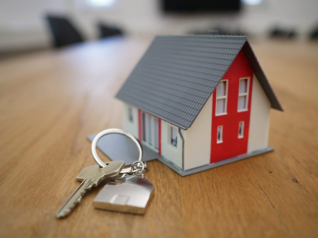 Model House With New Home Key Attached