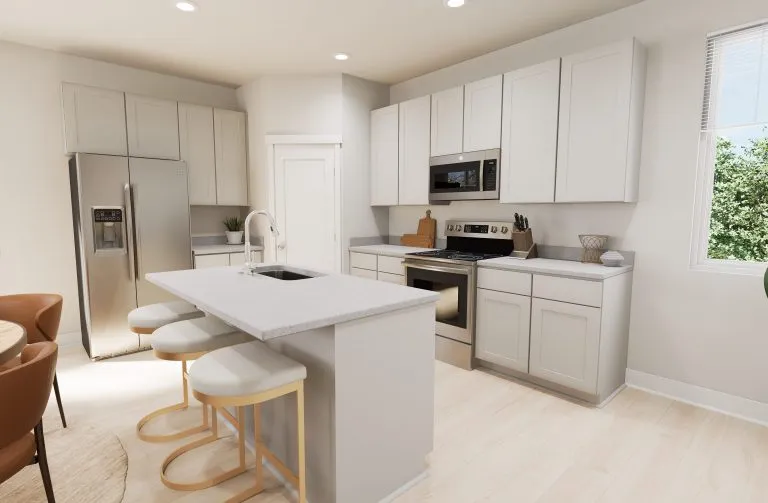 Modern kitchen with light-colored cabinets, stainless steel appliances, a central island with two stools, a round dining table with chairs, and a window letting in natural light—perfect for homes in Utah.